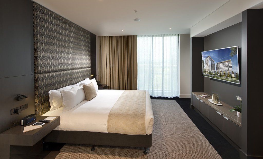 Pullman Brisbane Airport Hotel Exterior foto A bedroom at the hotel